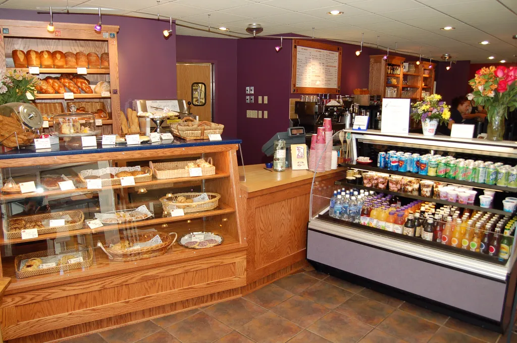 A bakery service counter and display cases